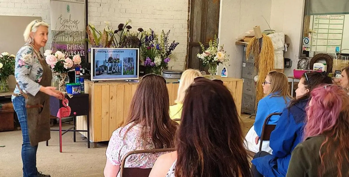Image shows Helen Chambers NDSF during a workshop. Evolve Flowers provides education through workshops, mentoring and demonstrations.