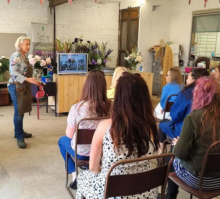Image shows Helen Chambers NDSF during a workshop. Evolve Flowers provides education through workshops, mentoring and demonstrations. Moble version
