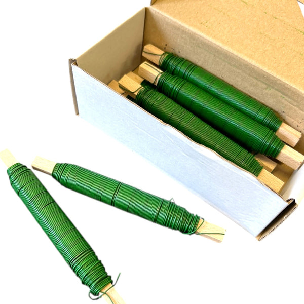 Green mossing wire on wooden stick for sustainable floristry and Christmas wreath making