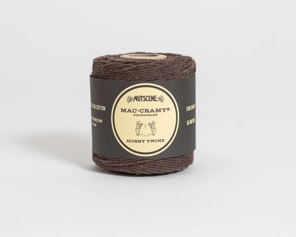 Brown twine roll with a label on a light gray background