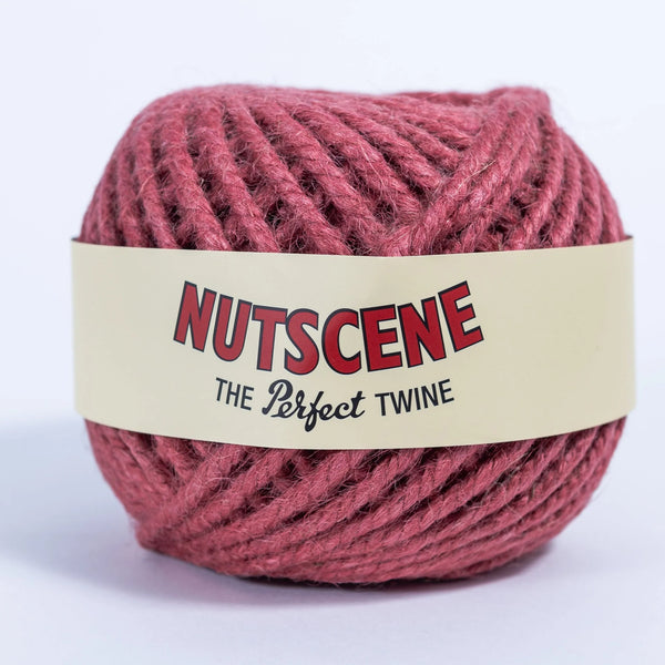 Ball of red twine with 'Nutscene' label on a white background