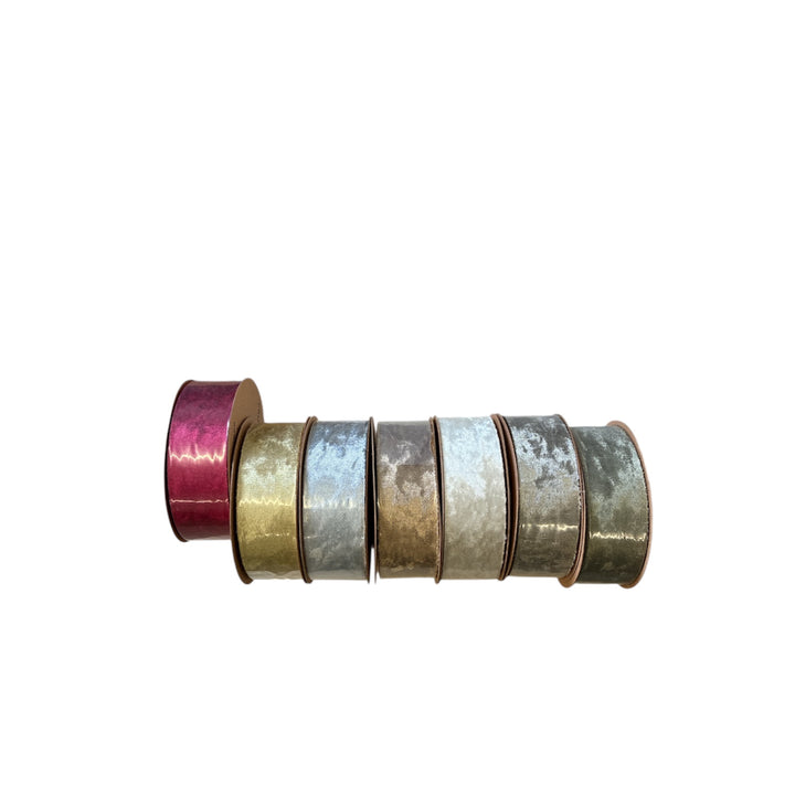 Set of metallic tape rolls in various colors on a white background
