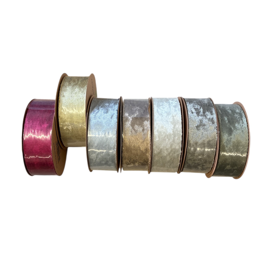 Set of metallic tape rolls in various colors on a white background
