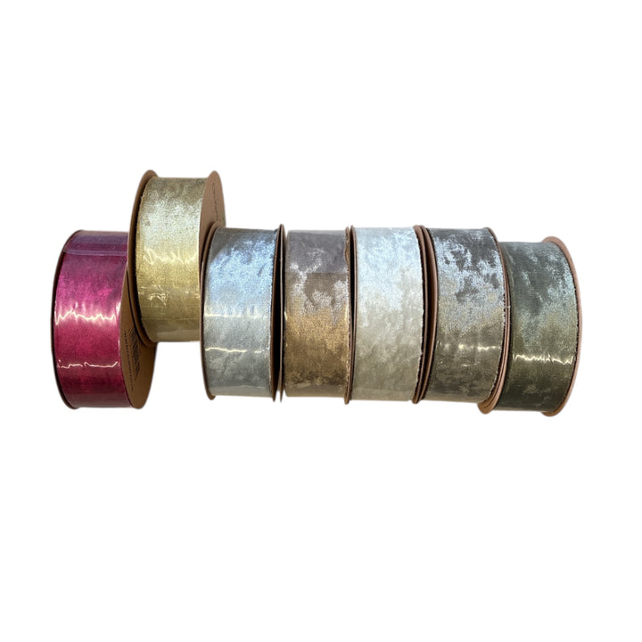 Set of metallic tape rolls in various colors on a white background