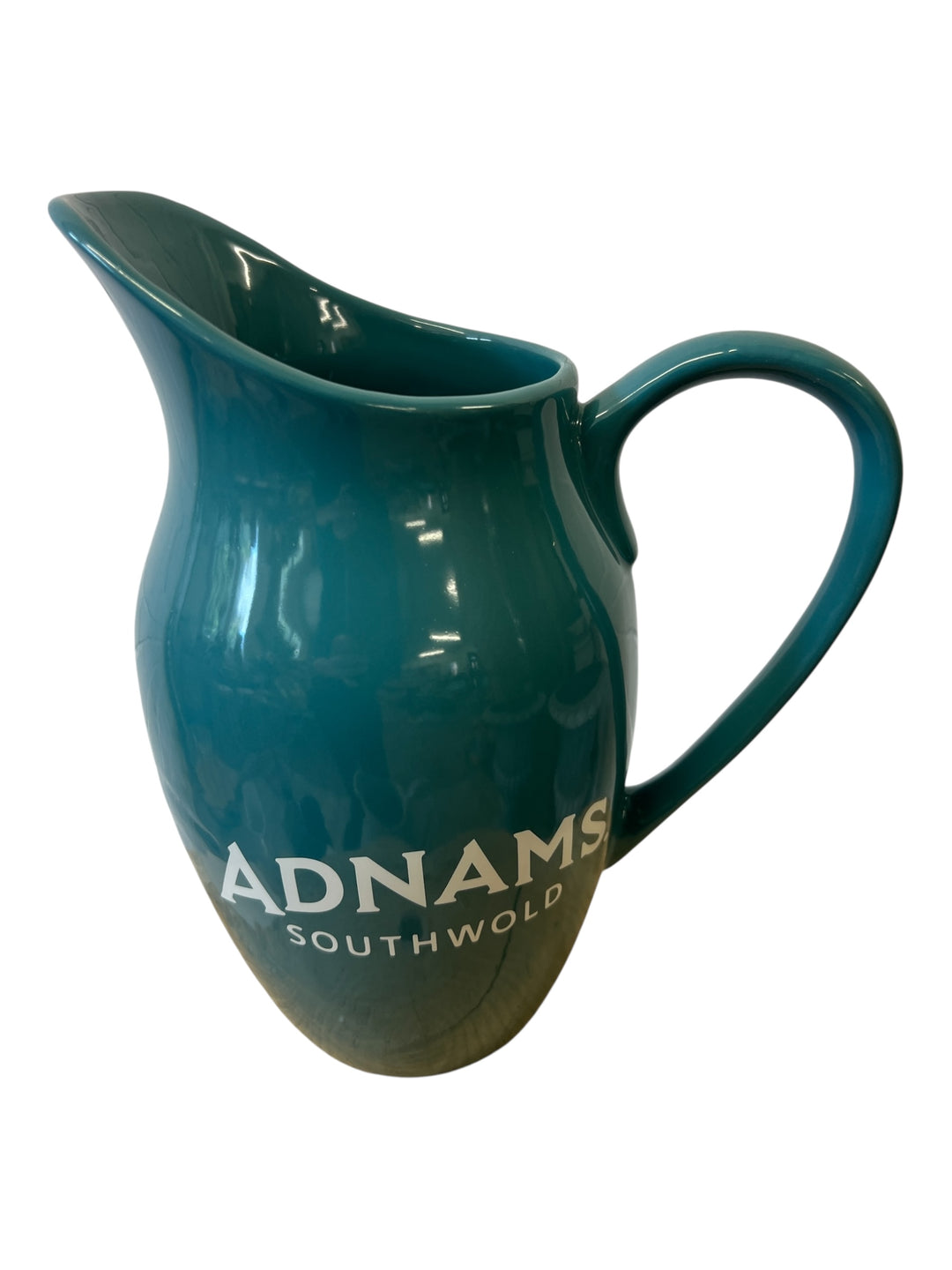 Teal pitcher with 'ADNAMS SOUTHWOLD' branding on a white background