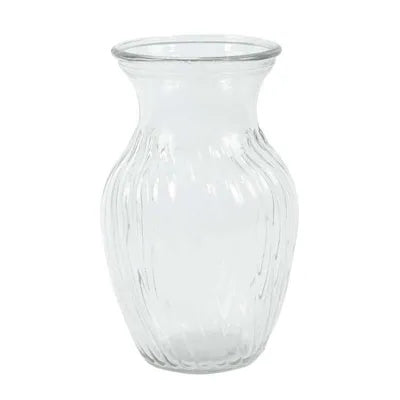 A clear glass vase with a heart-shaped design, suitable for flowers.