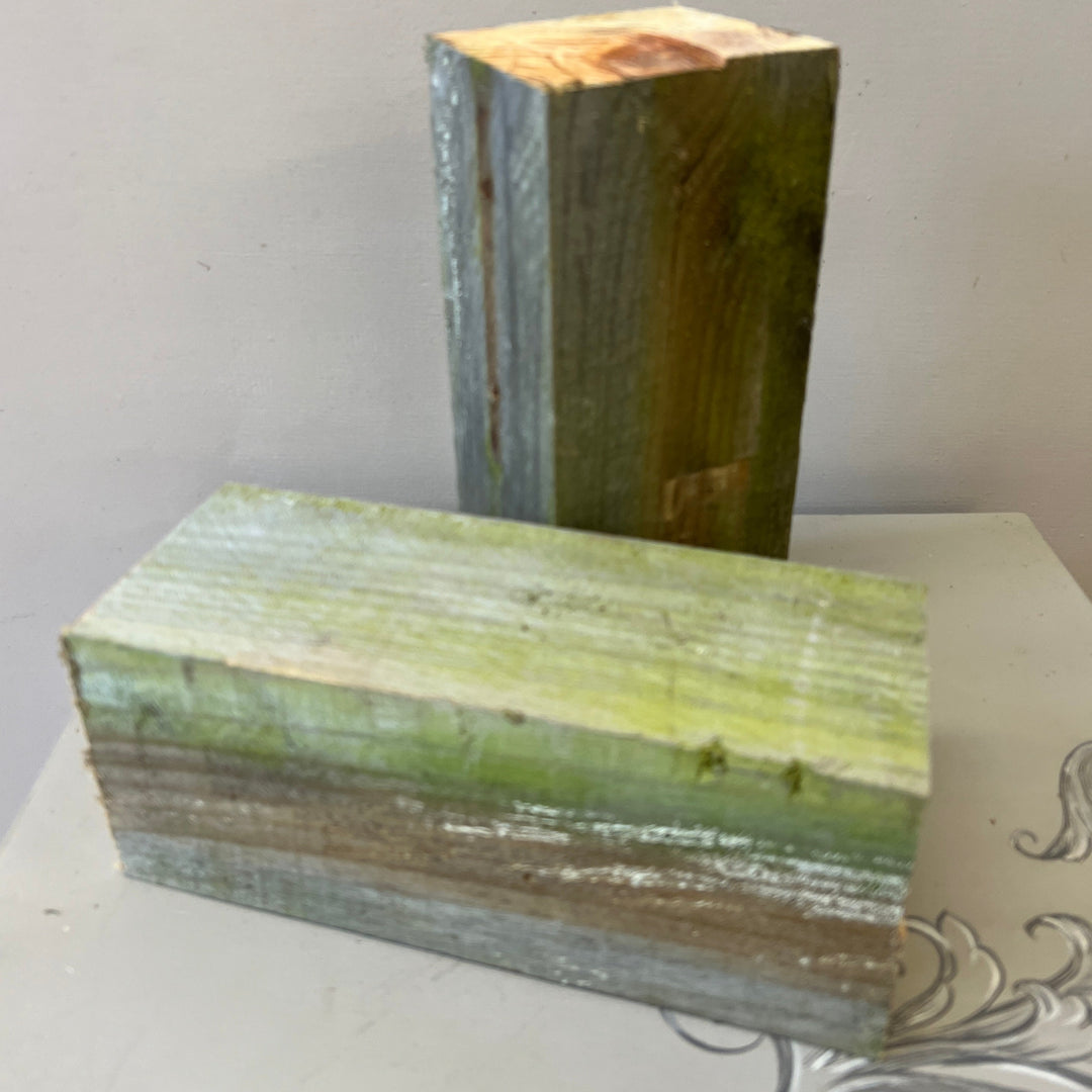 A solid natural wood block measuring 10cm x 10cm x 25cm, showing the raw timber grain and clean straight edges used for event staging