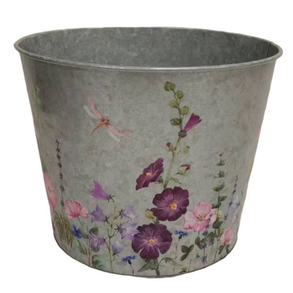 A round zinc pot with a floral design featuring various meadow flowers and a dragonfly.
