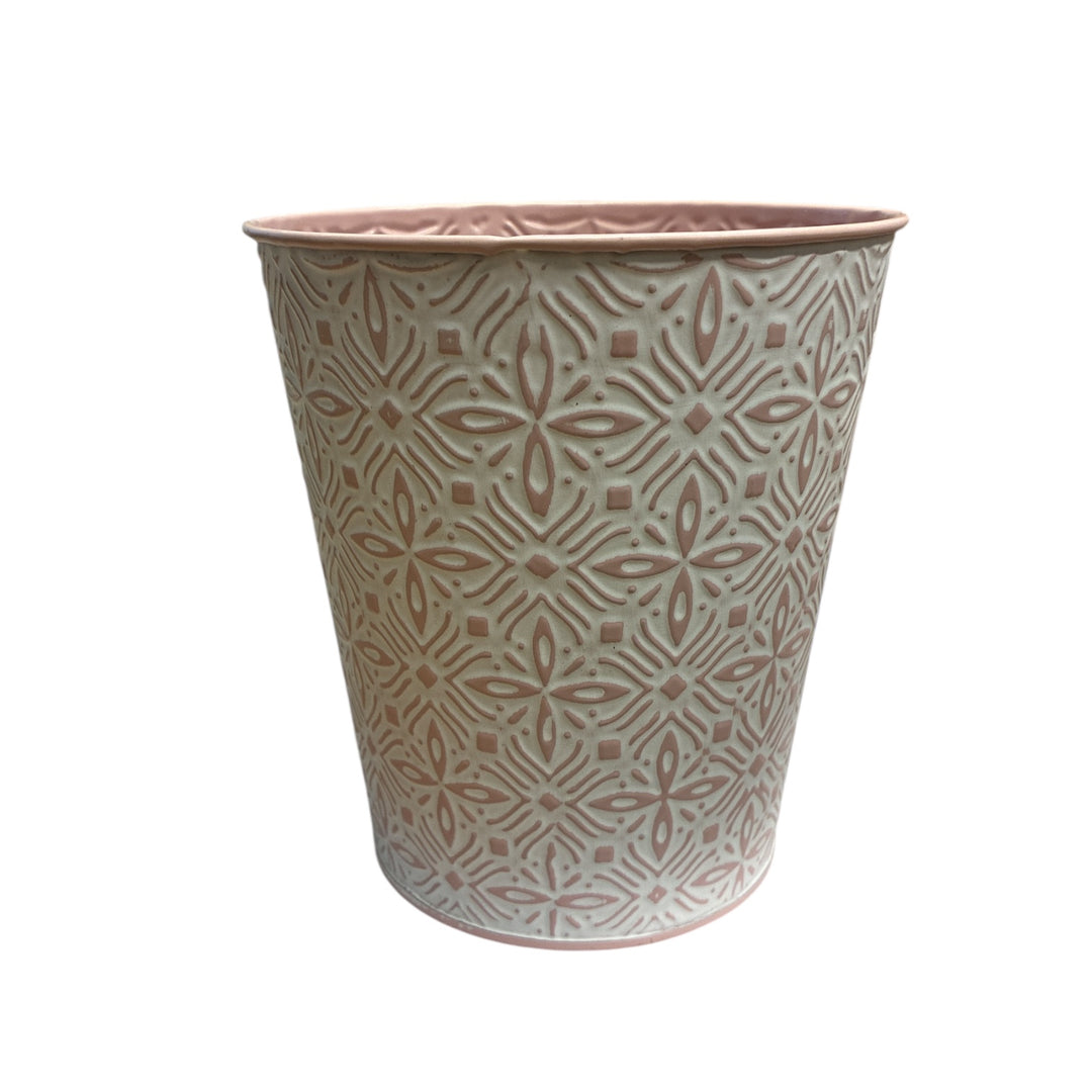 Decorative zinc planter with geometric pattern on a white background