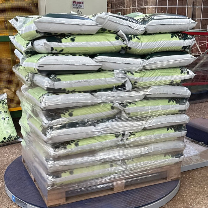 Full bulk pallet of All Purpose Peat Free Compost bags stacked for trade delivery.