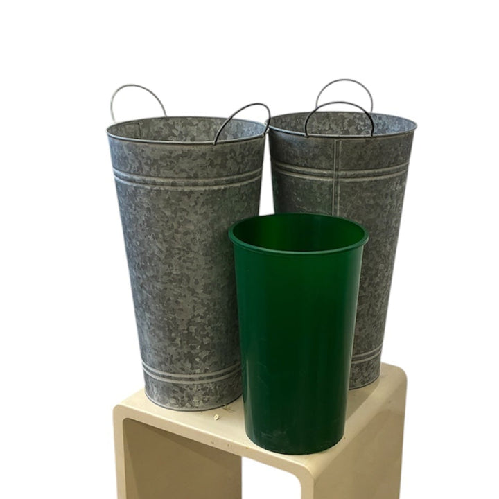 Two 36cm Balmoral zinc flower vases shown side by side with a reusable green plastic vase liner insert to demonstrate how the liner fits inside.