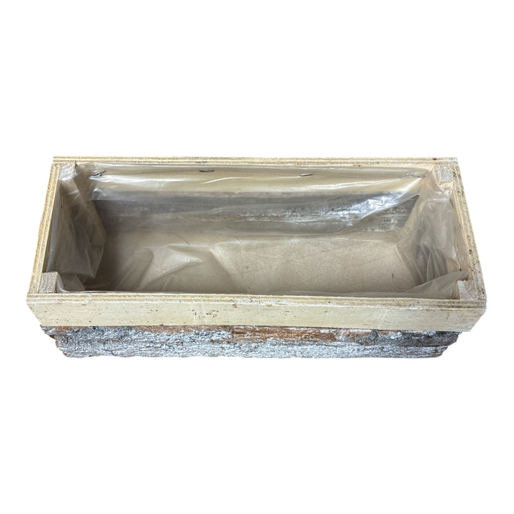 Top-down interior view of natural bark trough showing the fitted waterproof plastic lining.