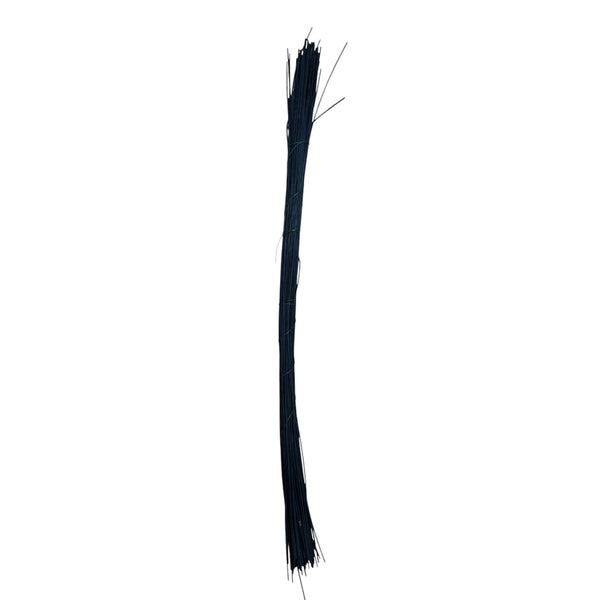 Black Midelino sticks used to create a geometric structure for a contemporary floral display, providing a bold silhouette against light-coloured blooms.