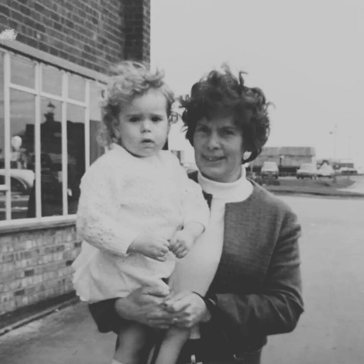 Black and white vintage photograph of the real Ivy holding a young child, the inspiration behind the Spinsterz Ivy MidiGaunt glove.