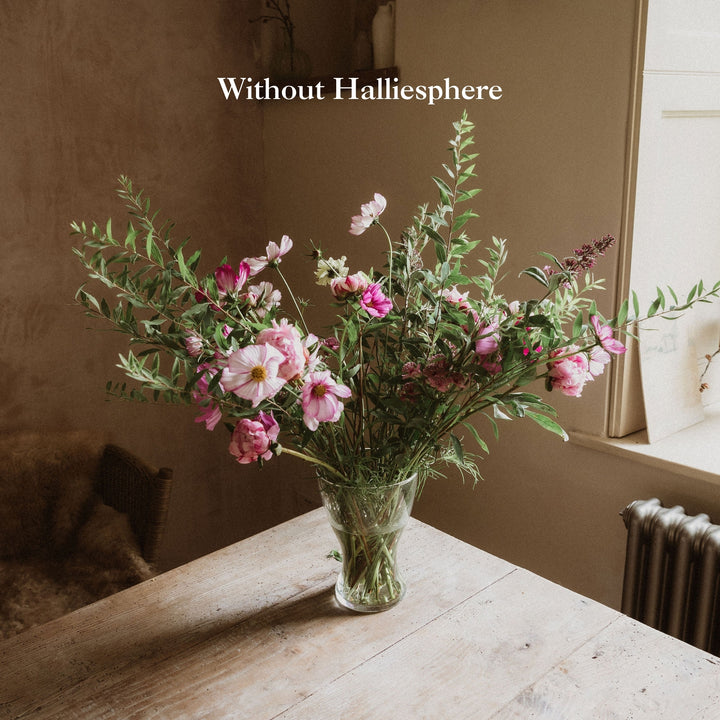 Flower arrangement without Halliesphere showing loose, drooping stems collapsing to the sides of a glass vase.